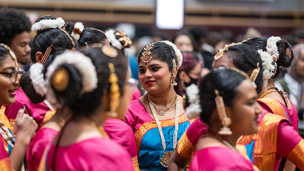 Taste of OSU hosted by the Office of International Affairs in the Archie Griffin Grand Ballroom at the Ohio Union. Student organizations cook international food, decorate a cultural booths and showcase cultural performances like dance and music. OSU Inaayat reacts to a performance on stage.