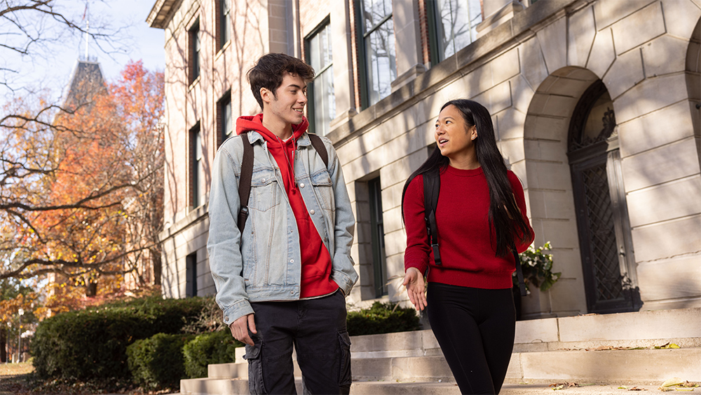 Students Owen Kline and Ally Gozum have a conversation outside of Bricker Hall on a late fall afternoon.