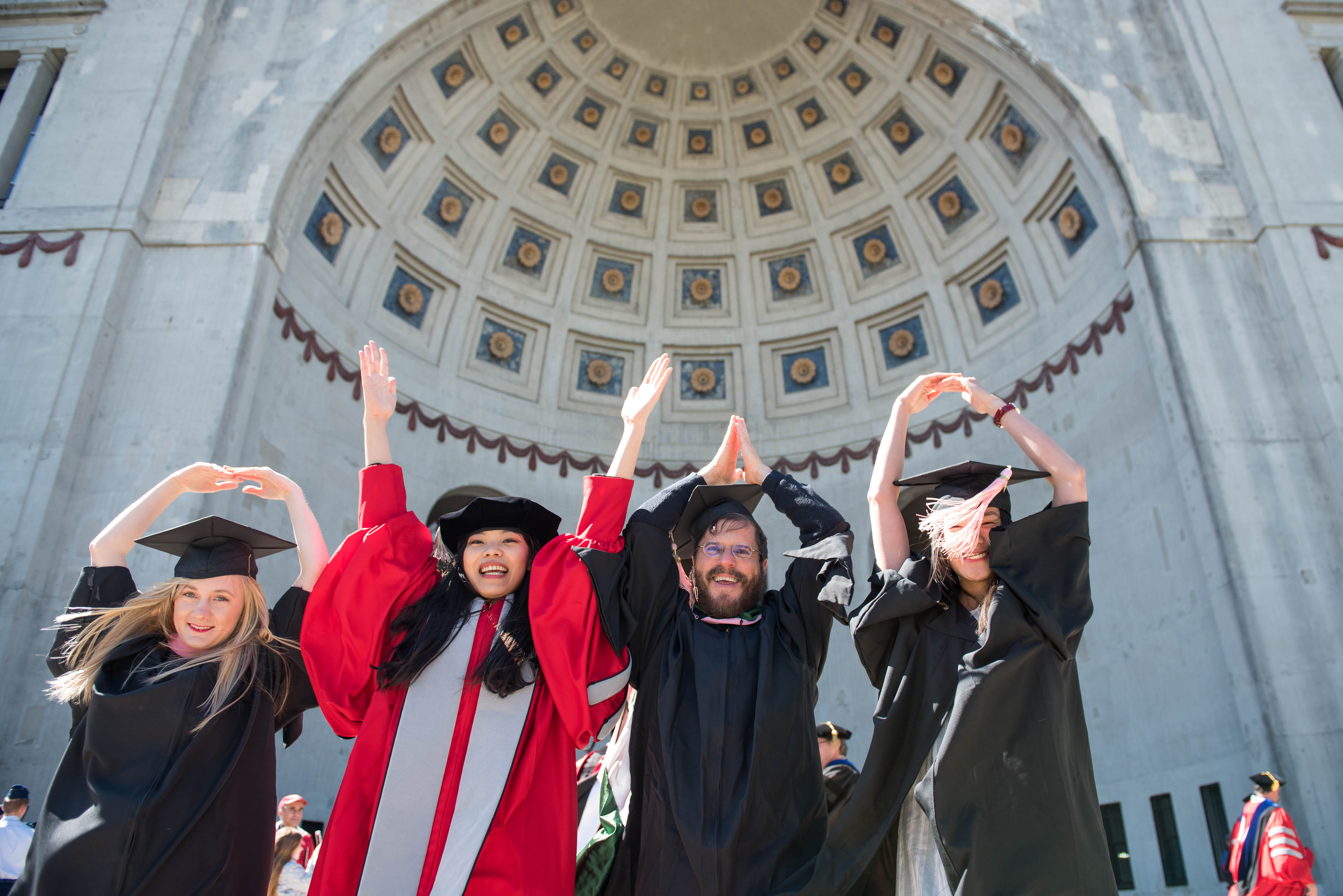 Graduates performing the O-H-I-O pose