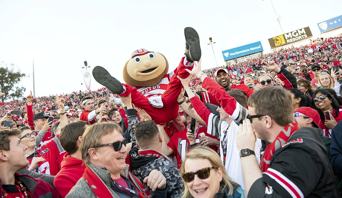 Brutus Buckeye held aloft by Ohio State football fans during a football game at Ohio Stadium.