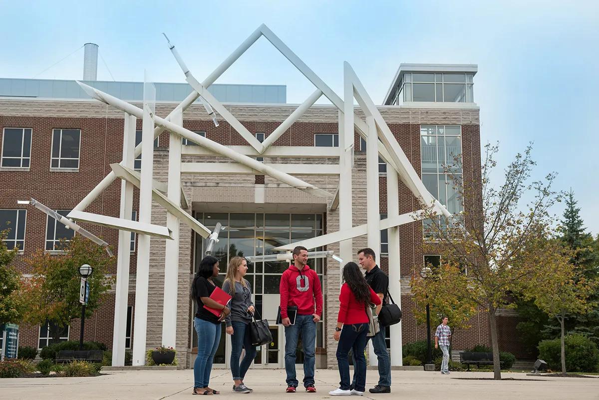 Five students stand in front of the Life and Physical Sciences building at Ohio State Lima.