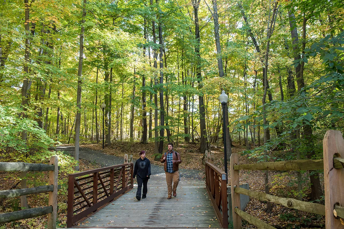 Two students walk on a bridge on the Ohio State Mansfield campus.