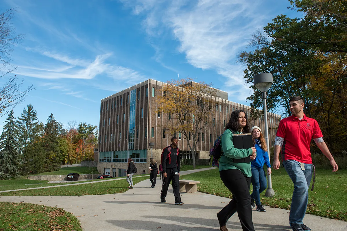Students walk outside of Ovalwood Hall at Ohio State Mansfield.
